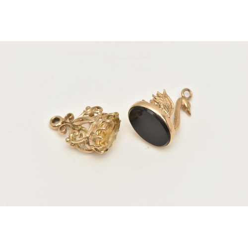 405 - TWO 9CT GOLD CHARMS, the first a swan shaped fob seal, set with a polished onyx inlay, hallmarked 9c... 