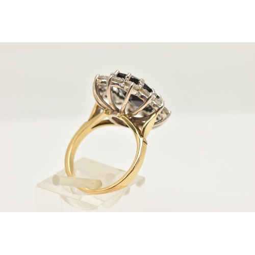 412 - AN 18CT GOLD LARGE SAPPHIRE AND DIAMOND CLUSTER RING, of an oval form, set with a central oval cut d... 