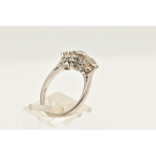 413 - A PLATINUM THREE STONE DIAMOND RING, three old cut diamonds, each claw set, central stone measuring ... 