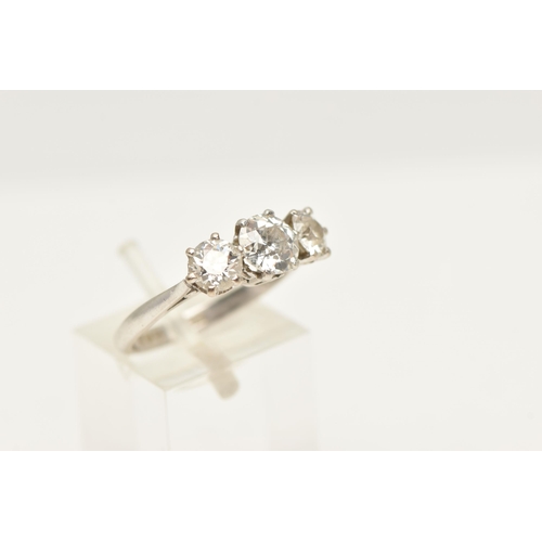 413 - A PLATINUM THREE STONE DIAMOND RING, three old cut diamonds, each claw set, central stone measuring ... 