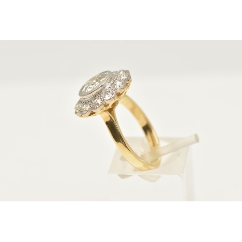 414 - AN 18CT GOLD DIAMOND CLUSTER RING, collet set with a central old cut diamond, spreads approximately ... 