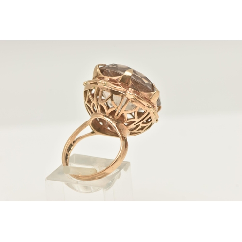 421 - A 9CT GOLD LARGE SMOKY QUARTZ DRESS RING, set with a circular cut smoky quartz, approximate diameter... 