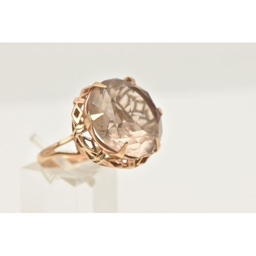 421 - A 9CT GOLD LARGE SMOKY QUARTZ DRESS RING, set with a circular cut smoky quartz, approximate diameter... 