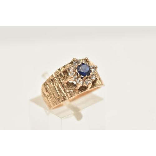 425 - A 9CT GOLD SAPPHIRE AND SPINEL CLUSTER RING, flower shape cluster set with a central circular cut bl... 