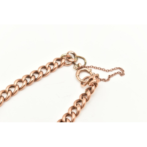 430 - AN EARLY 20TH CENTURY CHAIN BRACELET, a rose metal hollow curb link chain bracelet, fitted with a la... 