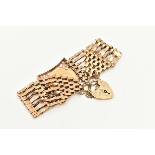 432 - A FULL SOVEREIGN GATE BRACELET, a seven bar gate bracelet mounted with a full sovereign depicting Ge... 