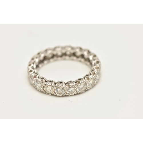 447 - A DIAMOND FULL ETERNITY BAND RING, twenty round brilliant cut diamonds prong set in white metal, app... 