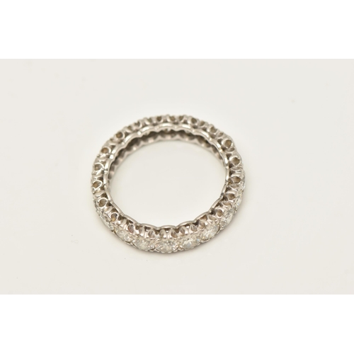 447 - A DIAMOND FULL ETERNITY BAND RING, twenty round brilliant cut diamonds prong set in white metal, app... 