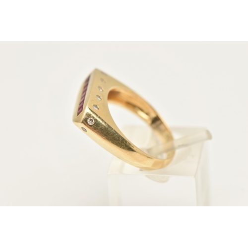 453 - A YELLOW METAL GEM SET SIGNET RING, a rectangular form signet ring, channel set to the top with seve... 