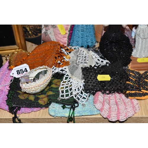 854 - A LARGE QUANTITY OF VINTAGE BEADWORK to include a large group of small beaded pouches, ten female fi... 