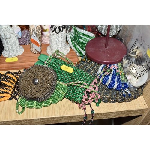 854 - A LARGE QUANTITY OF VINTAGE BEADWORK to include a large group of small beaded pouches, ten female fi... 