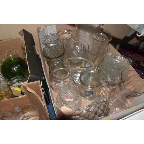 912 - THREE BOXES AND LOOSE GLASSWARE, to include a clear glass rolling pin, two boxed sets of four John L... 