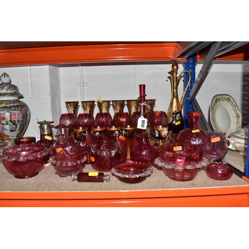 950 - A LARGE QUANTITY OF CRANBERRY GLASSWARE, to include, cranberry and gilt bohemian decanter, six champ... 