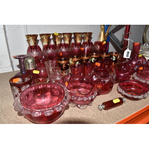 950 - A LARGE QUANTITY OF CRANBERRY GLASSWARE, to include, cranberry and gilt bohemian decanter, six champ... 