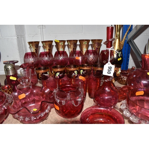 950 - A LARGE QUANTITY OF CRANBERRY GLASSWARE, to include, cranberry and gilt bohemian decanter, six champ... 