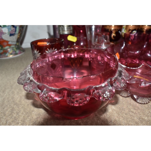 950 - A LARGE QUANTITY OF CRANBERRY GLASSWARE, to include, cranberry and gilt bohemian decanter, six champ... 