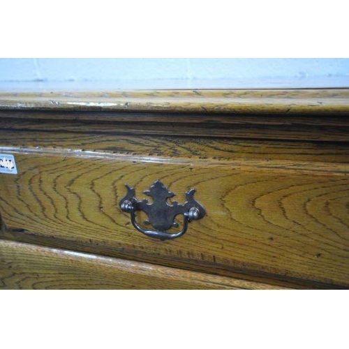 148 - A 20TH CENTURY GEORGIAN STYLE OAK CHEST OF TWO SHORT OVER THREE LONG DRAWERS, with reeded front corn... 