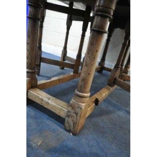 150 - AN 18TH CENTURY STYLE OAK WAKE TABLE, raised on block and turned legs, open width 143cm x closed wid... 