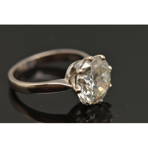 410 - A MODERN 18CT WHITE GOLD, DIAMOND SINGLE STONE RING, set with a round brilliant cut diamond, within ... 