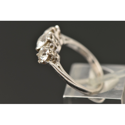 413 - A PLATINUM THREE STONE DIAMOND RING, three old cut diamonds, each claw set, central stone measuring ... 