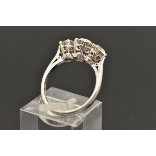 413 - A PLATINUM THREE STONE DIAMOND RING, three old cut diamonds, each claw set, central stone measuring ... 