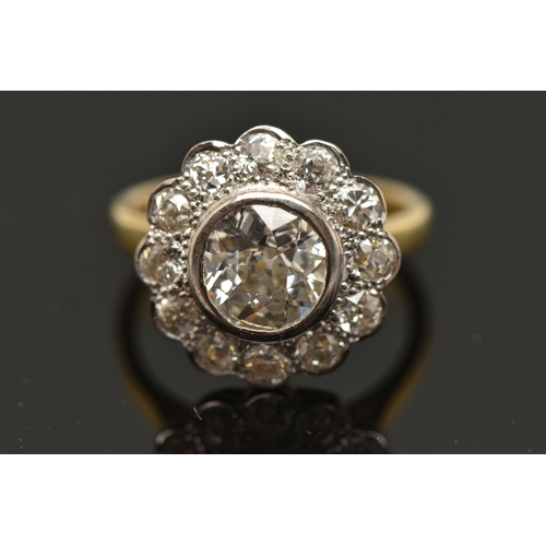 414 - AN 18CT GOLD DIAMOND CLUSTER RING, collet set with a central old cut diamond, spreads approximately ... 