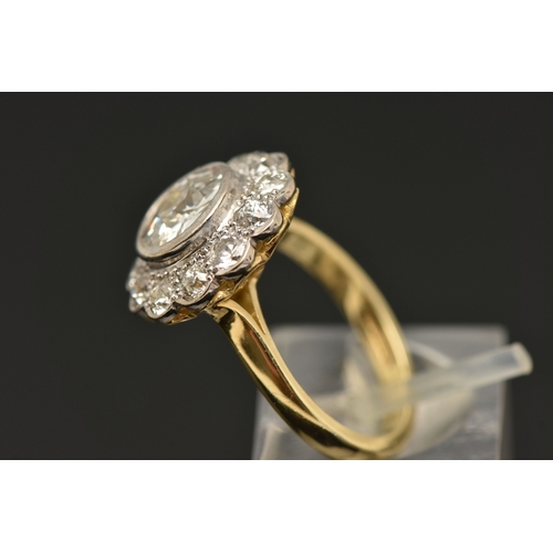 414 - AN 18CT GOLD DIAMOND CLUSTER RING, collet set with a central old cut diamond, spreads approximately ... 