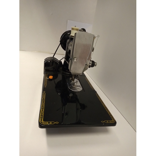 933 - A SINGER MODEL 222K SEWING MACHINE AND TWO VASES to include a cased Singer model '222k' sewing machi... 