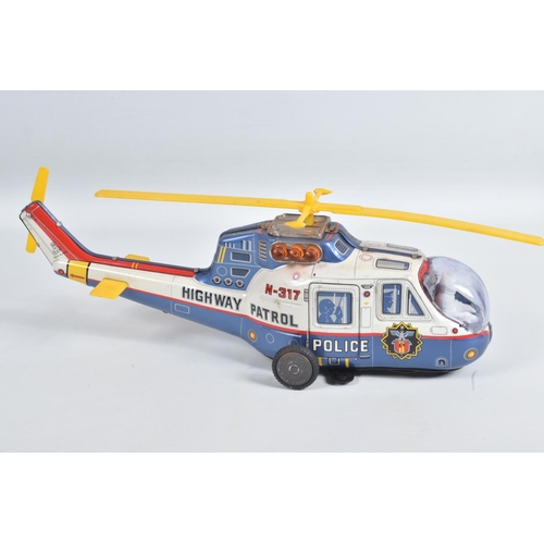 1 - A BOXED T.P.S. JAPAN BATTERY OPERATED TINPLATE SUPER FLYING POLICE HELICOPTER, No.9094, not tested, ... 