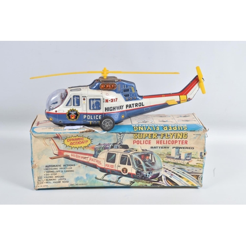 1 - A BOXED T.P.S. JAPAN BATTERY OPERATED TINPLATE SUPER FLYING POLICE HELICOPTER, No.9094, not tested, ... 