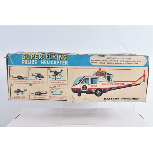 1 - A BOXED T.P.S. JAPAN BATTERY OPERATED TINPLATE SUPER FLYING POLICE HELICOPTER, No.9094, not tested, ... 