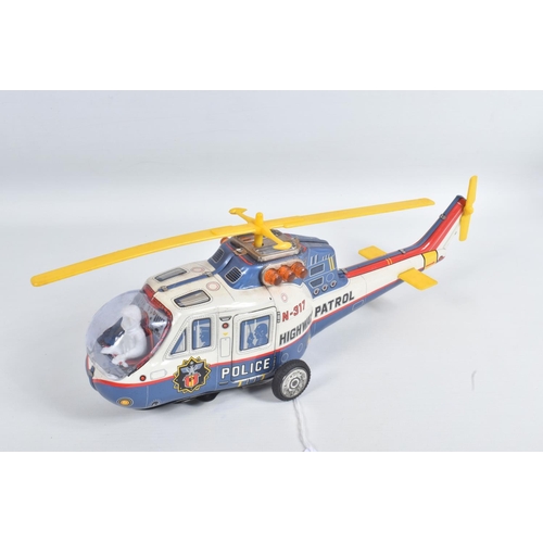 1 - A BOXED T.P.S. JAPAN BATTERY OPERATED TINPLATE SUPER FLYING POLICE HELICOPTER, No.9094, not tested, ... 