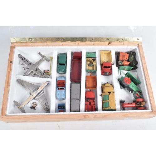 26 - A WOODEN CABINET CONTAINING A COLLECTION OF UNBOXED AND ASSORTED PLAYWORN 1950'S DINKY TOYS, to incl... 