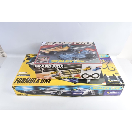 56 - TWO BOXED VINTAGE SCALEXTRIC RACING SETS, to include a two car Grand Prix set, number C698,  it is i... 