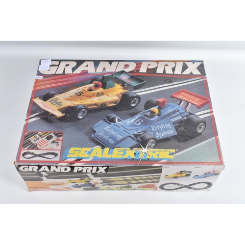 56 - TWO BOXED VINTAGE SCALEXTRIC RACING SETS, to include a two car Grand Prix set, number C698,  it is i... 