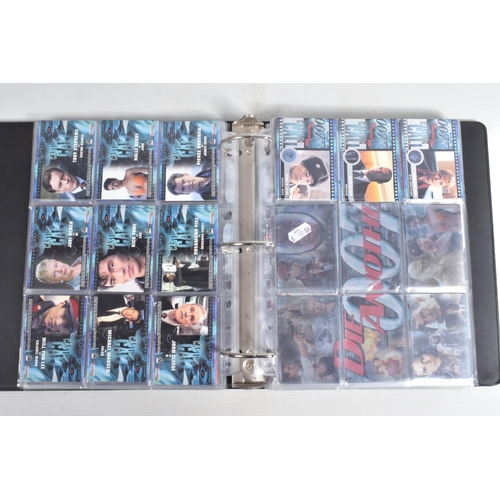 93 - A COLLECTION OF JAMES BOND 007 TRADING CARDS,  to include a binder with cards housed in plastic fold... 