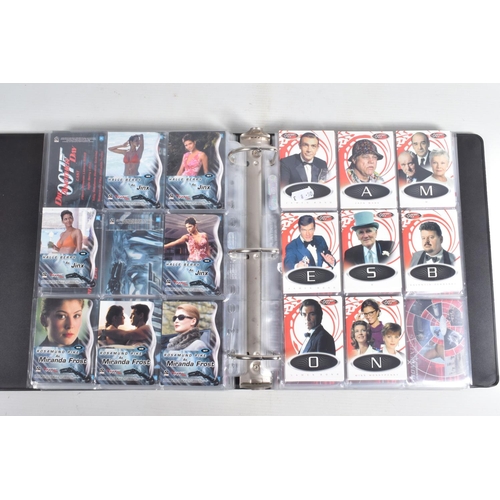 93 - A COLLECTION OF JAMES BOND 007 TRADING CARDS,  to include a binder with cards housed in plastic fold... 