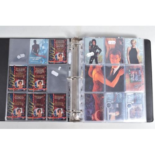 93 - A COLLECTION OF JAMES BOND 007 TRADING CARDS,  to include a binder with cards housed in plastic fold... 