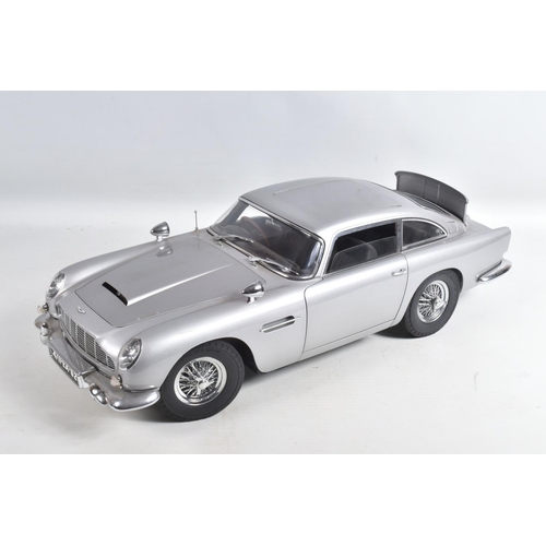 107 - A CONSTRUCTED 1/8 SCALE MODEL OF THE JAMES BOND 007 GOLDFINGER ASTON MARTIN DB5, from the G.E. Fabbr... 