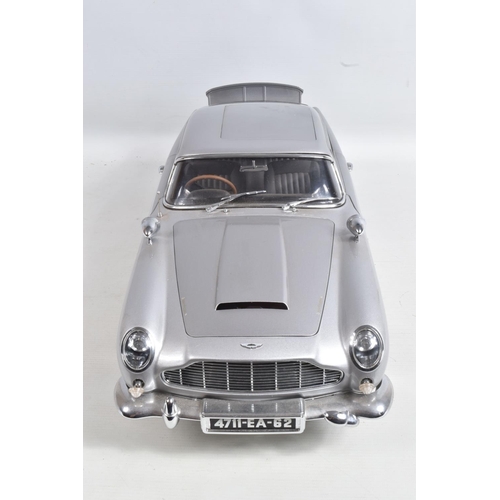 107 - A CONSTRUCTED 1/8 SCALE MODEL OF THE JAMES BOND 007 GOLDFINGER ASTON MARTIN DB5, from the G.E. Fabbr... 