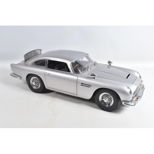 107 - A CONSTRUCTED 1/8 SCALE MODEL OF THE JAMES BOND 007 GOLDFINGER ASTON MARTIN DB5, from the G.E. Fabbr... 