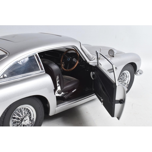 107 - A CONSTRUCTED 1/8 SCALE MODEL OF THE JAMES BOND 007 GOLDFINGER ASTON MARTIN DB5, from the G.E. Fabbr... 