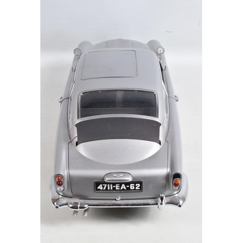 107 - A CONSTRUCTED 1/8 SCALE MODEL OF THE JAMES BOND 007 GOLDFINGER ASTON MARTIN DB5, from the G.E. Fabbr... 