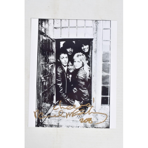 194 - TWO SIGNED 10   X 8   PHOTOGRAPHS OF PAUL McCARTNEY, the first is a black and white photograph of Pa... 