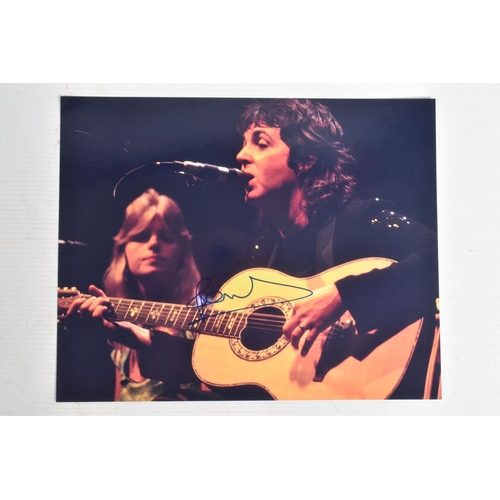 194 - TWO SIGNED 10   X 8   PHOTOGRAPHS OF PAUL McCARTNEY, the first is a black and white photograph of Pa... 