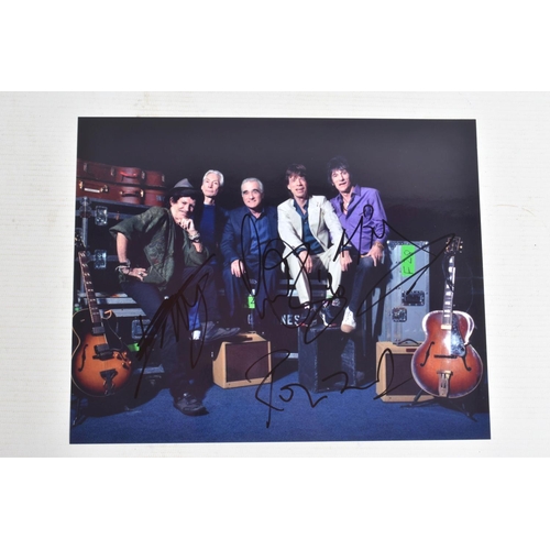 195 - FOUR SIGNED 10   X 8   PHOTOGRAPHS OF THE ROLLING STONES BAND, each photograph is in colour and sign... 