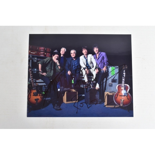 195 - FOUR SIGNED 10   X 8   PHOTOGRAPHS OF THE ROLLING STONES BAND, each photograph is in colour and sign... 