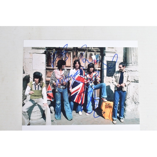 195 - FOUR SIGNED 10   X 8   PHOTOGRAPHS OF THE ROLLING STONES BAND, each photograph is in colour and sign... 