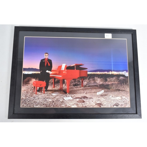 199 - SIGNED AND FRAMED PHOTOGRAPHS OF STING AND OF ELTON JOHN, the framed Sting photograph is a promotion... 