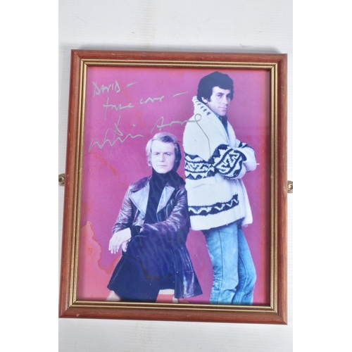 212 - A COLLECTION OF FRAMED SIGNED PHOTOGRAPHS, to include David Soul on a Starsky and Hutch print, Rober... 